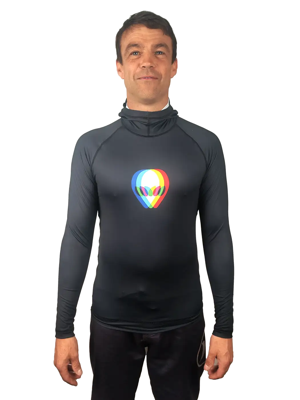 A man wearing a black long-sleeve rash vest with a colorful alien head graphic on the chest, set against a plain white background.